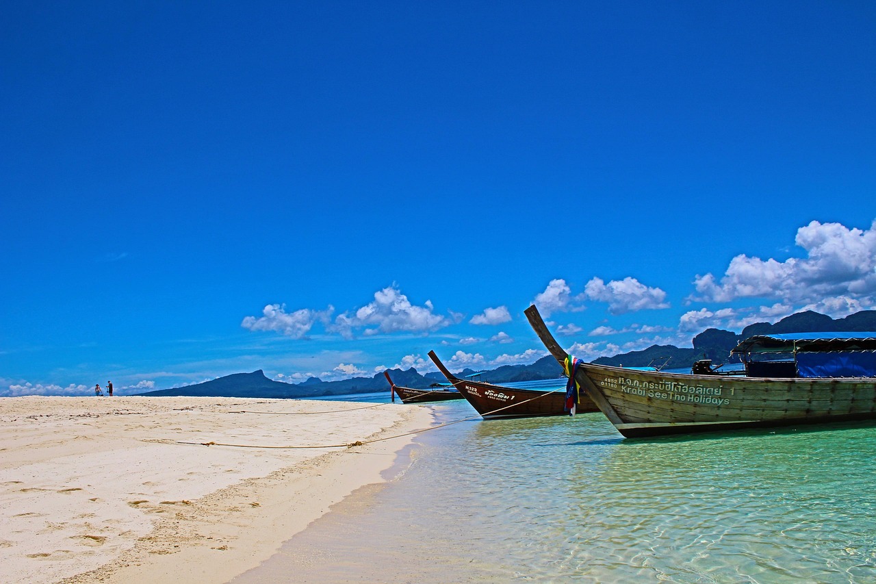 Longtail boats on a beach in Krabi Thailand